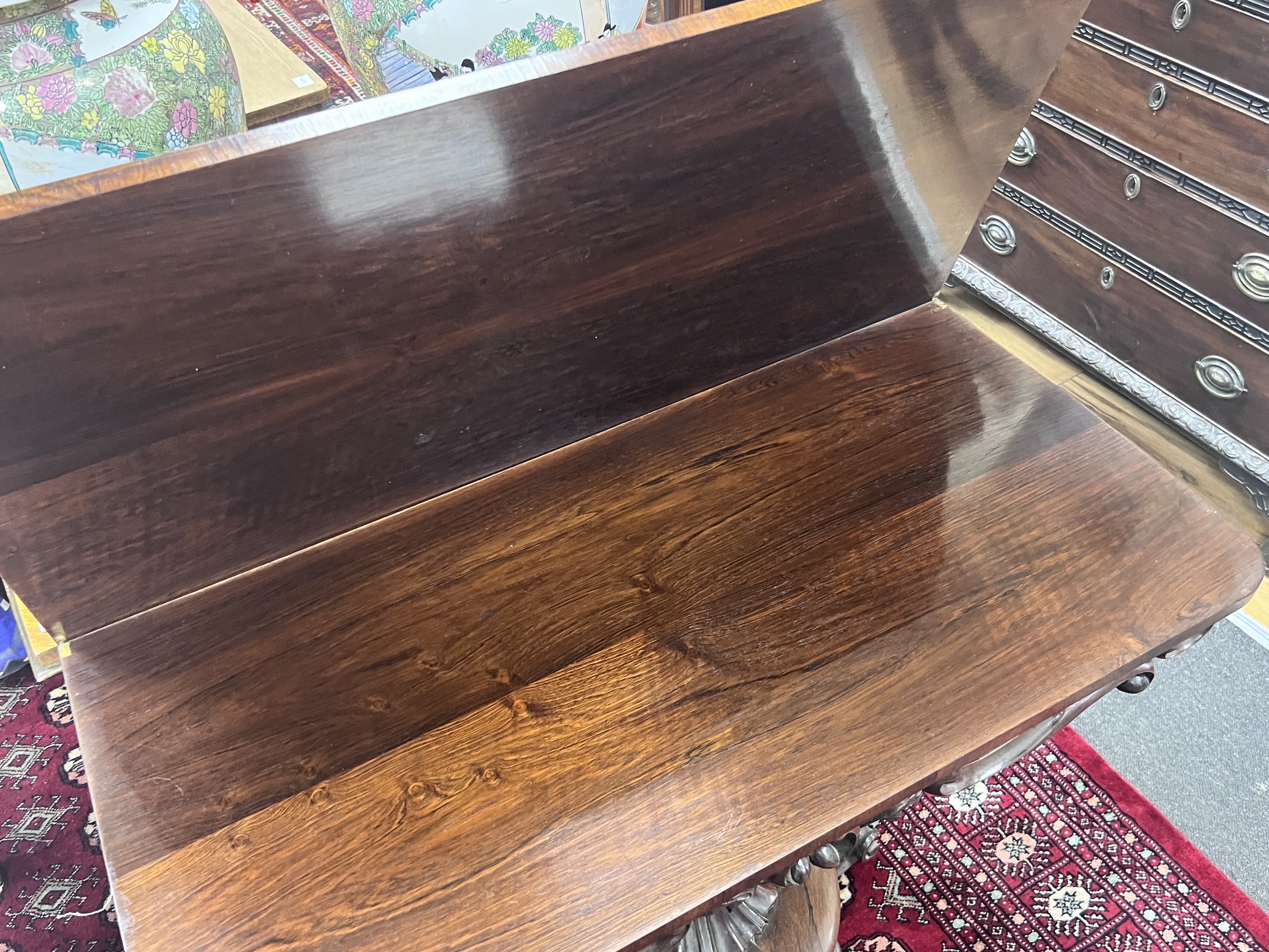 An early Victorian rosewood folding tea table, width 91cm, depth 45cm, height 75cm